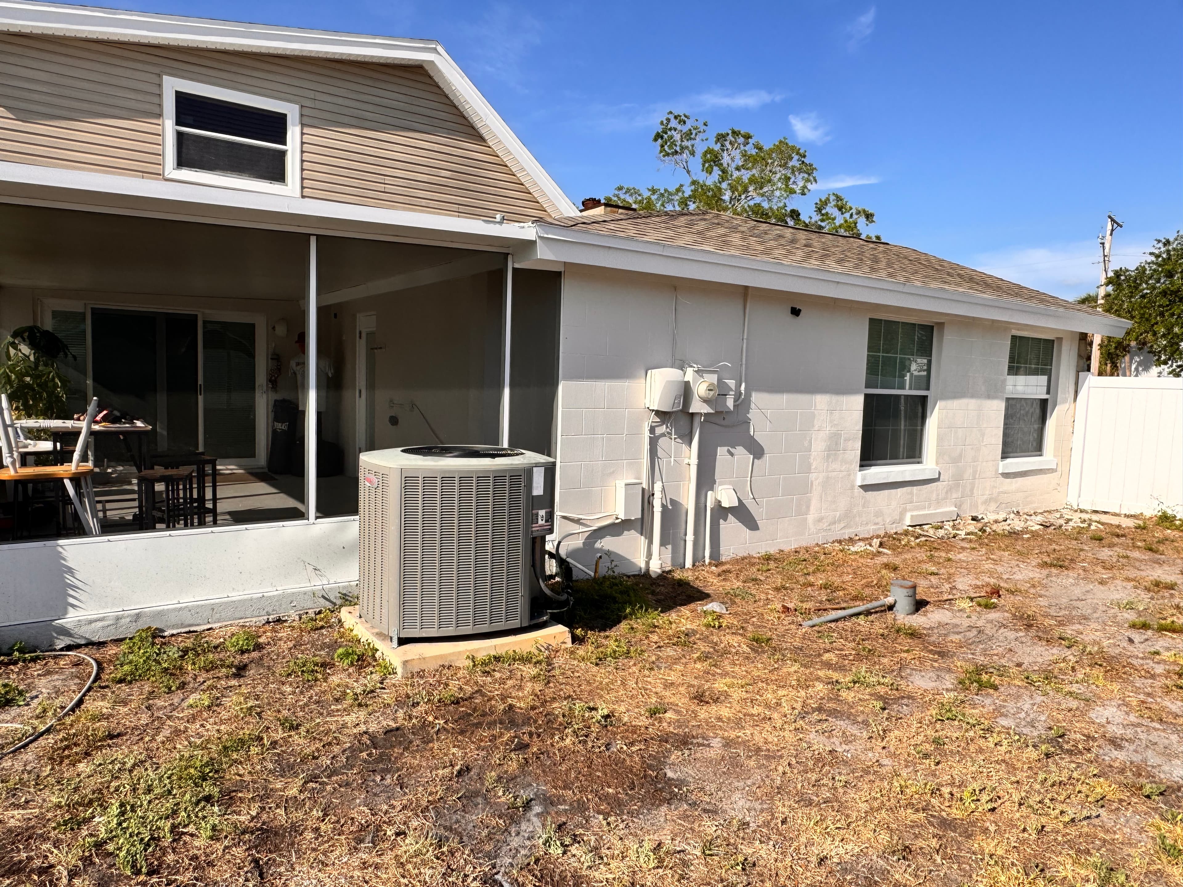After photo of residential home front angle with clean trim lines, fresh paint, and updated curb appeal