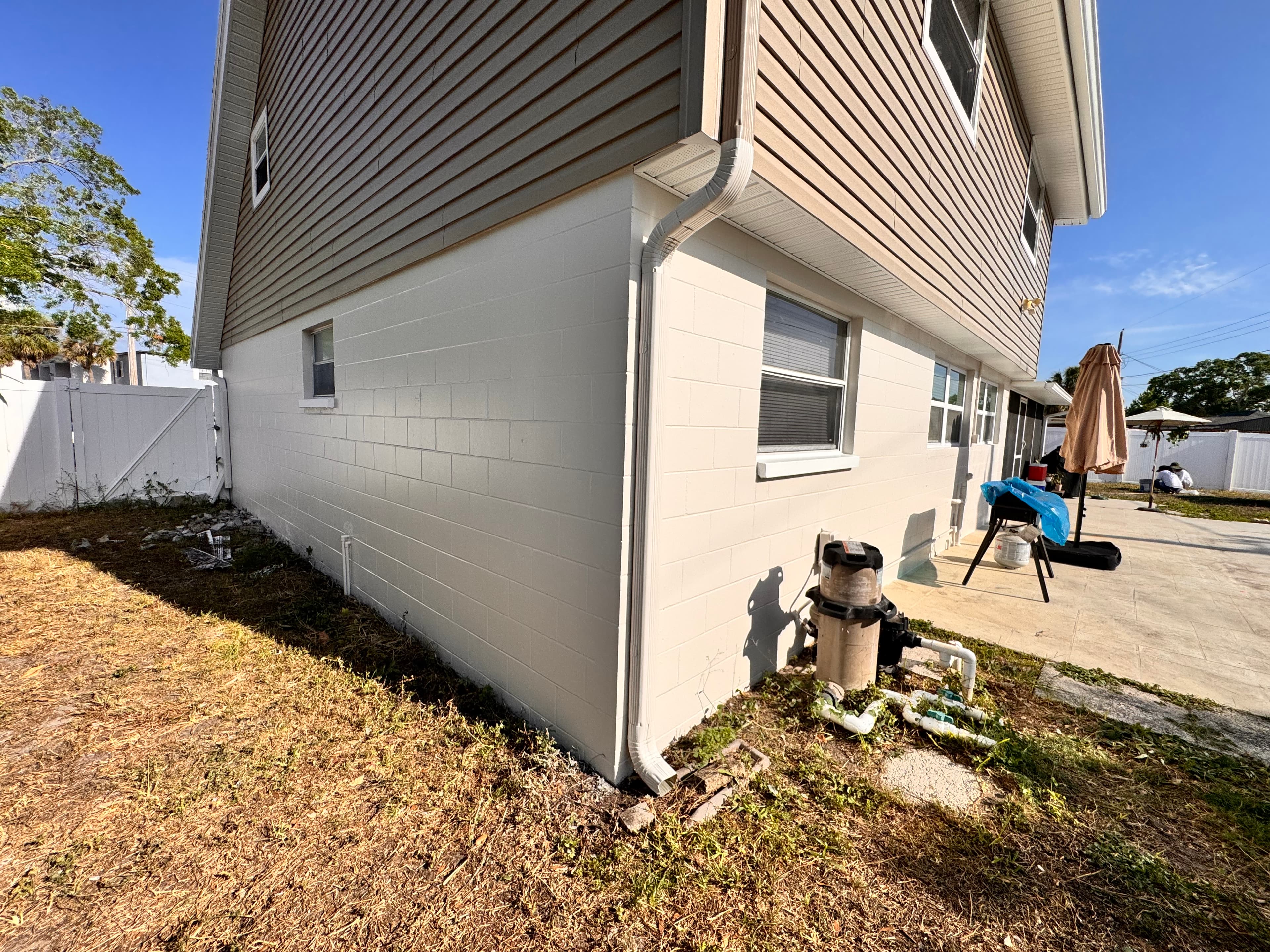 After photo of residential home side view with refreshed siding, crisp edges, and a modern look
